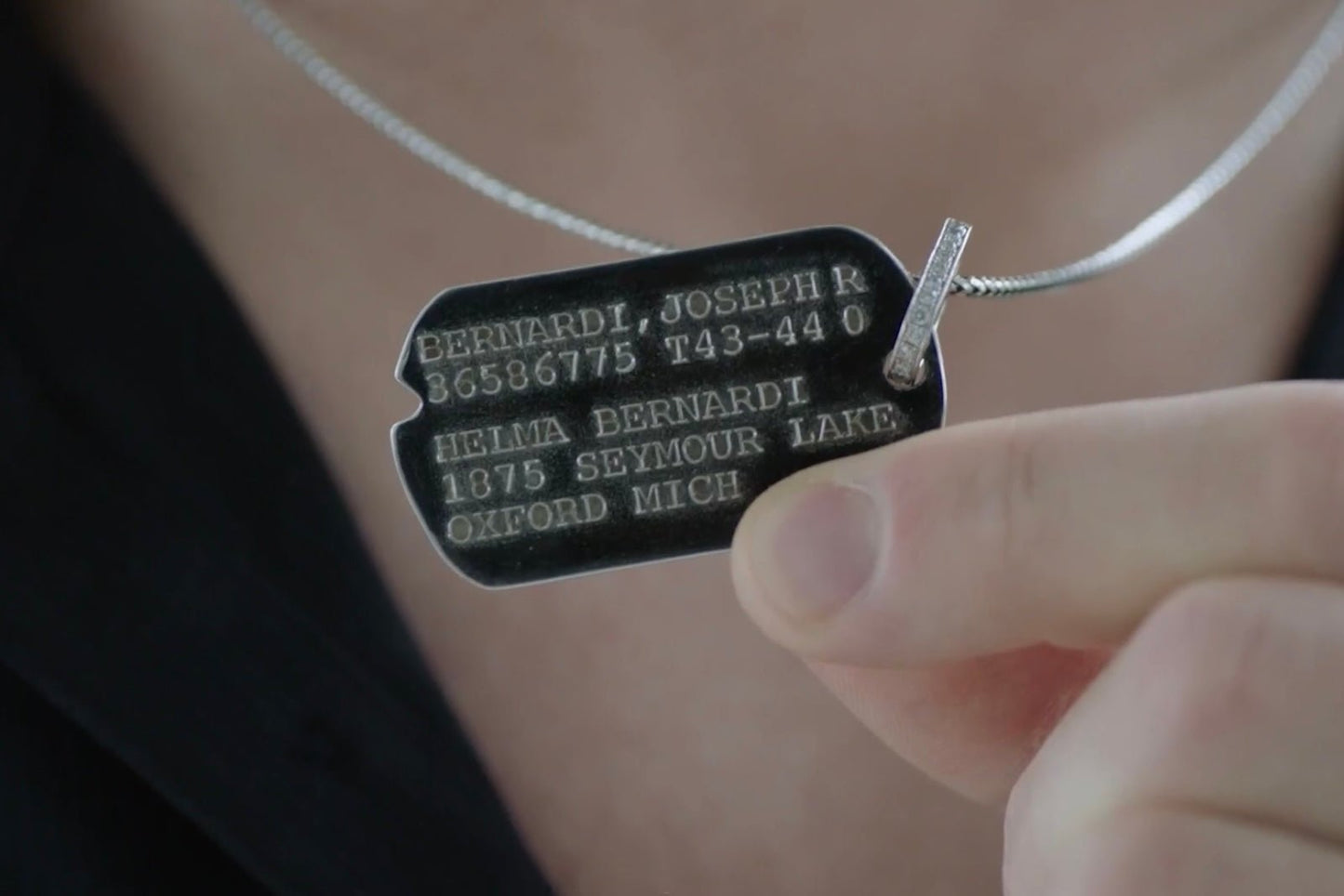 Aidan Hutchinson dog tag chain for USAA commerical