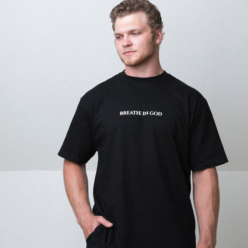 
                      
                        Aidan Hutchinson's Breathe In God Tee - Official merchandise from the House of Hutch.
                      
                    